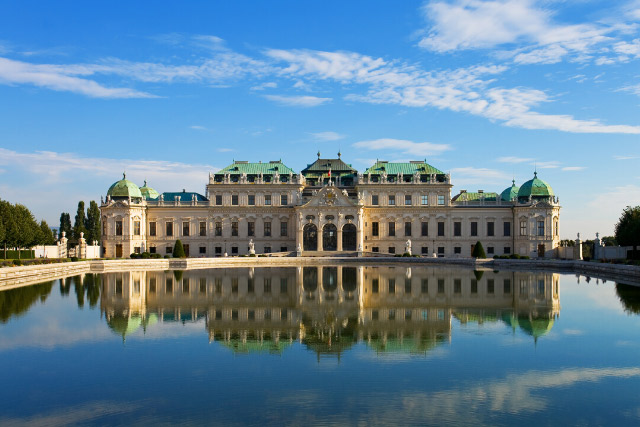 Reflection of palace building in water at Belvedere, Vienna