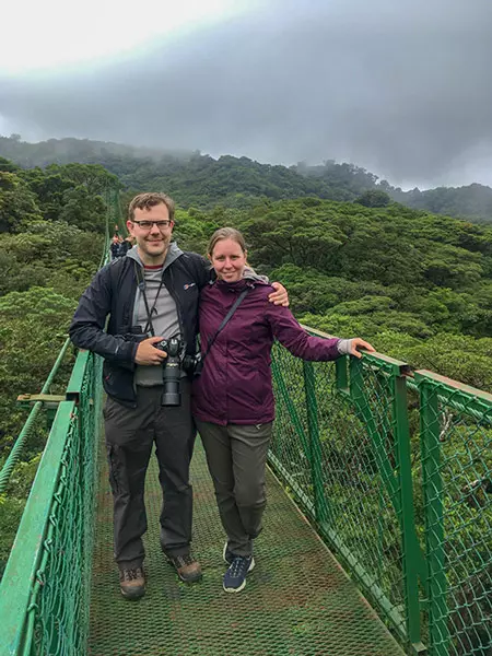 Couple on a hanging bridge in Monteverde