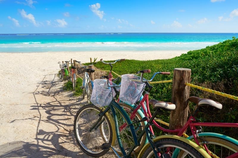 Many places to stay in Tulum offer bike rental to reach the beach
