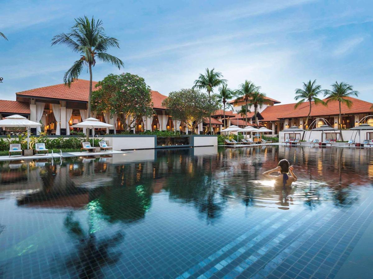 A lady in the swimming pool at Sofitel Singapore Sentosa Resort & Spa