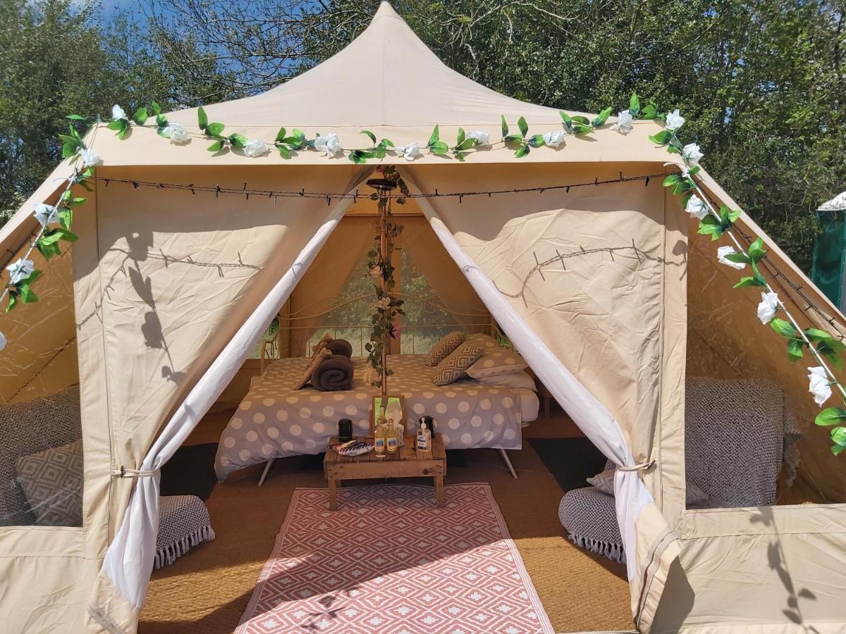 Looking into the open tent flaps of the beautiful Hopgarden Glamping site in East Sussex