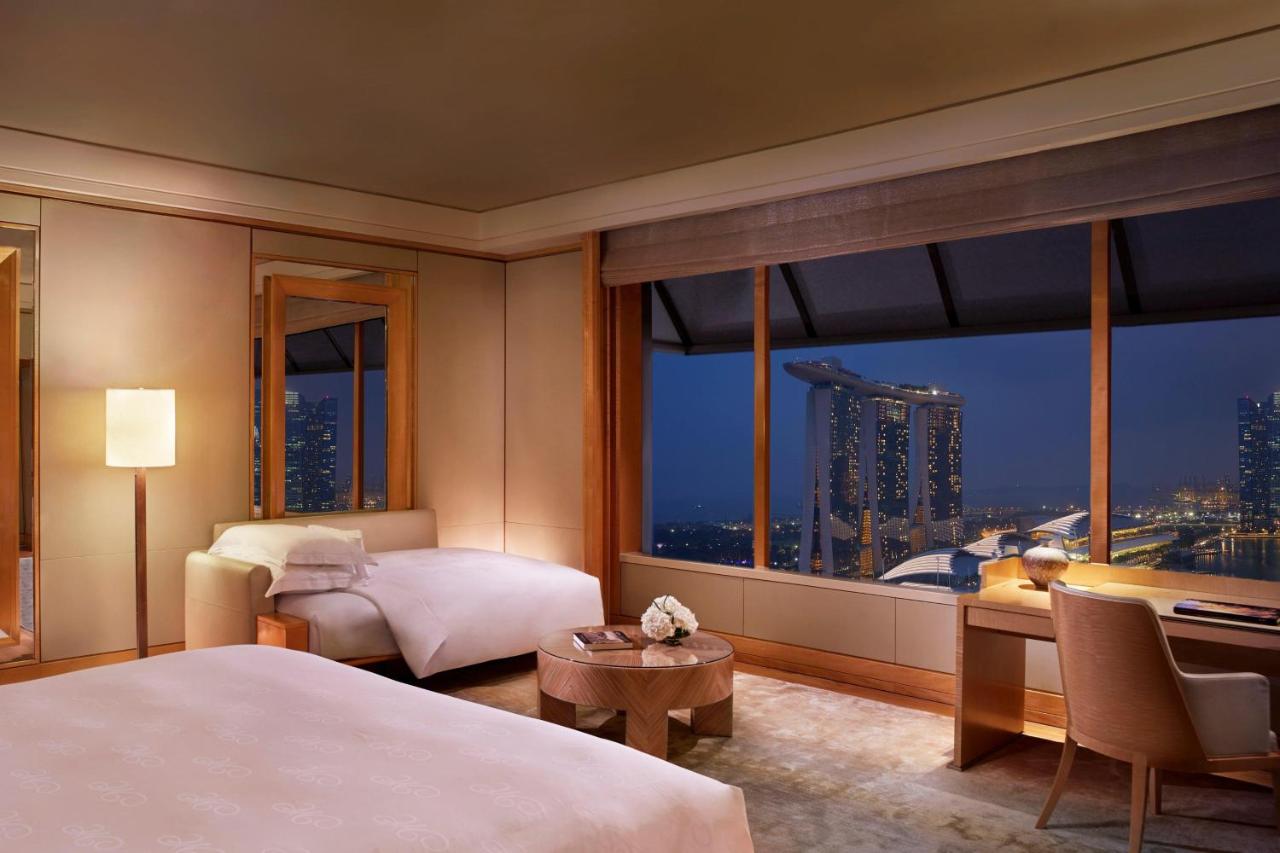 A guest room at the Ritz-Carlton Millenia with a view of the Marina Bay Sands hotel