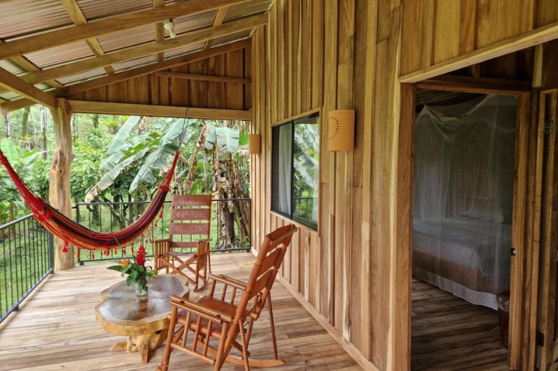 The terrace outside one of the bedrooms at Finca Amistad cacao lodge in Costa Rica