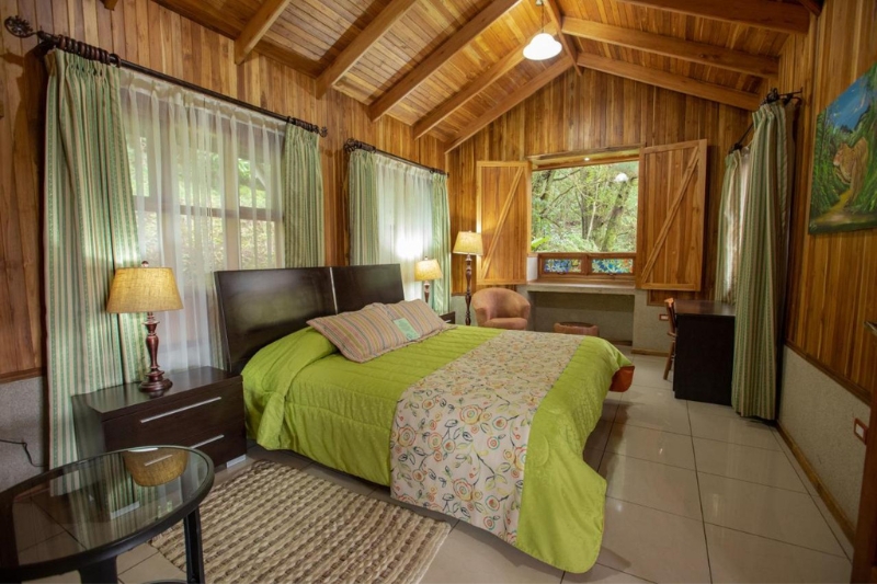 The bedroom overlooking the jungle at Los Pinos cabanas in Monteverde, Costa Rica